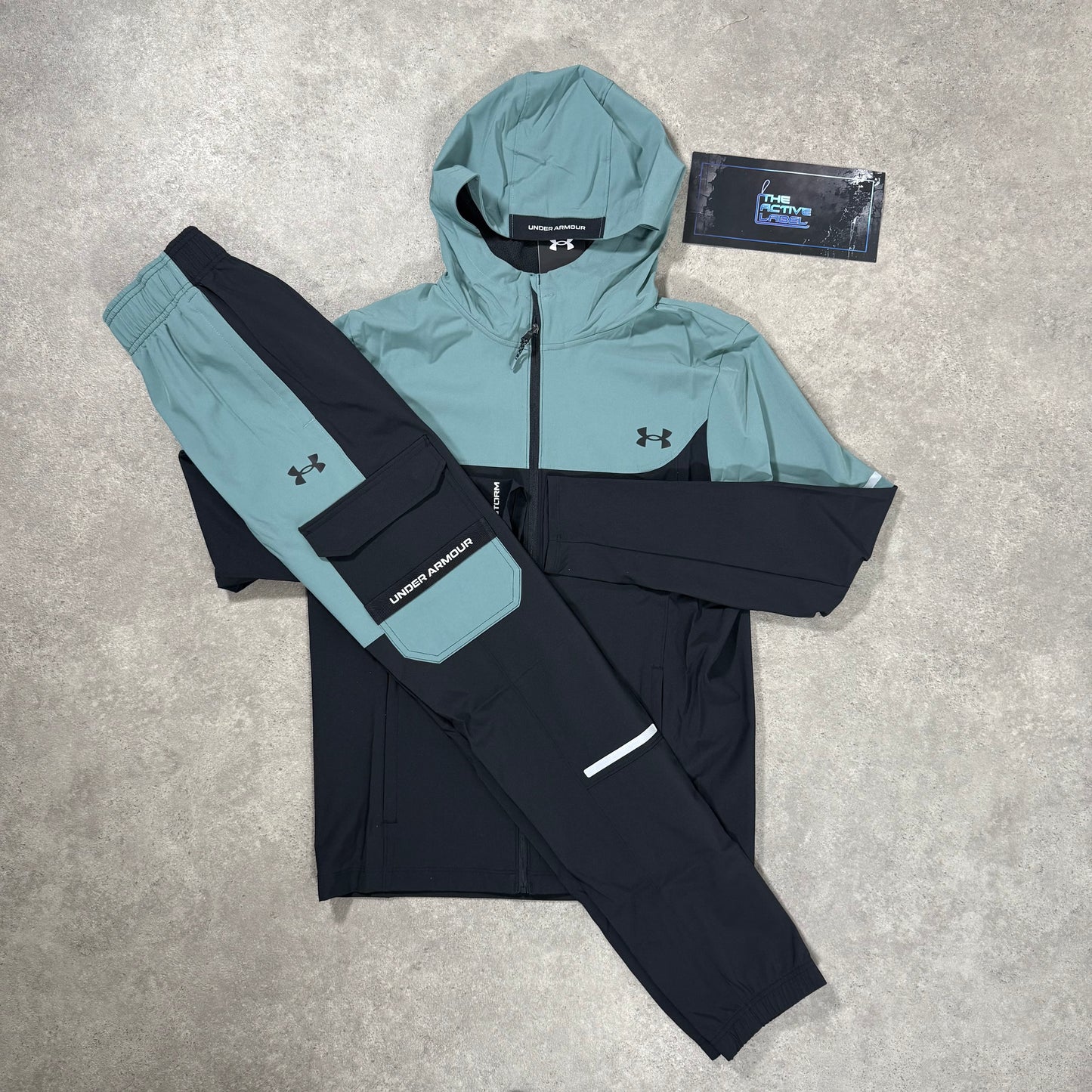 UNDER ARMOUR TECH UTILITY WOVEN TRACKSUIT (BLACK/JASPER BLUE)